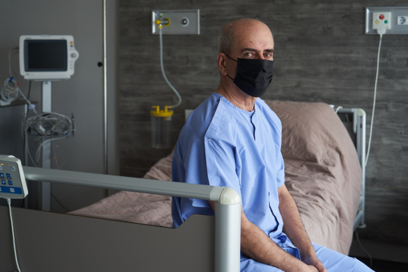 man in hospital with covid-19 coronavirus