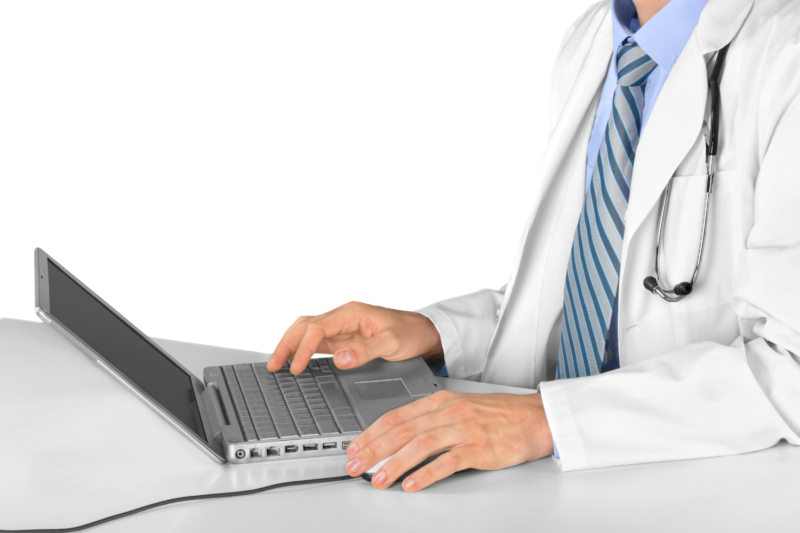Doctor at laptop on desk