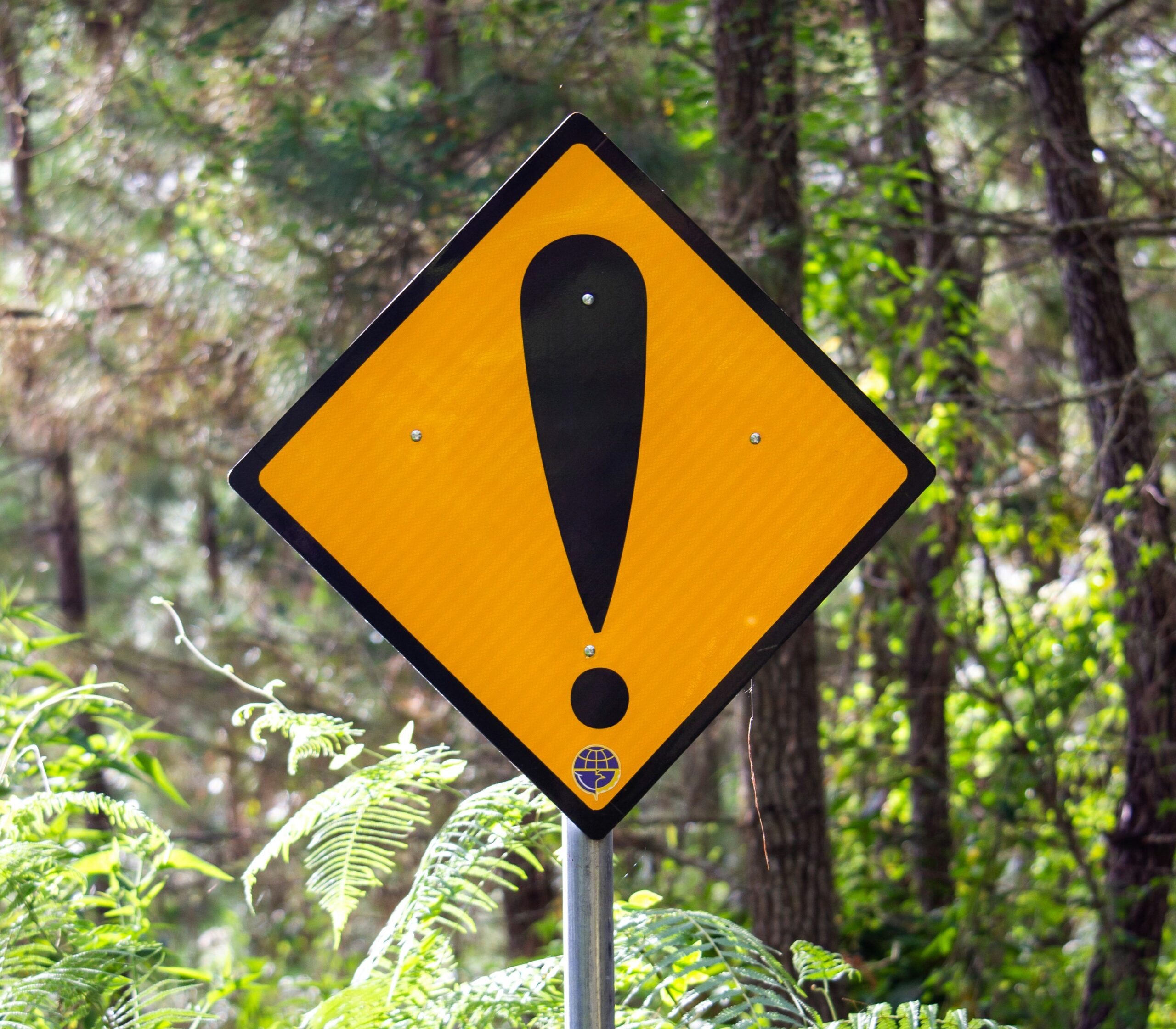 Diamond yellow road sign with exclamation mark