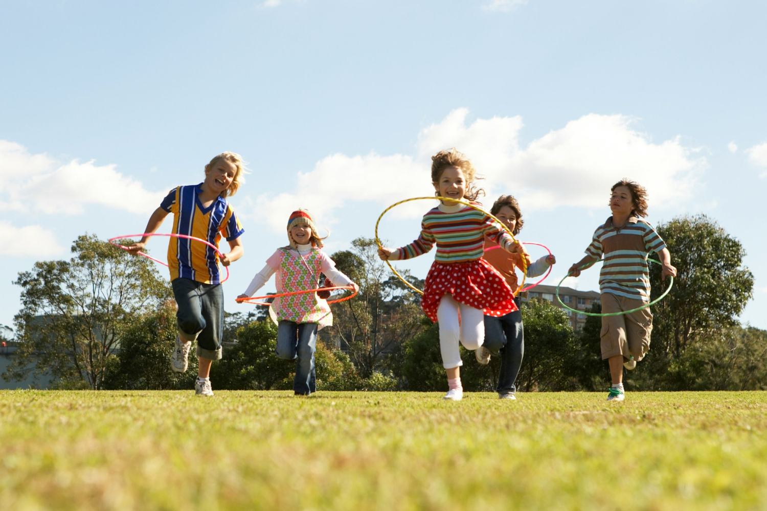 Image of children playing in a field.
